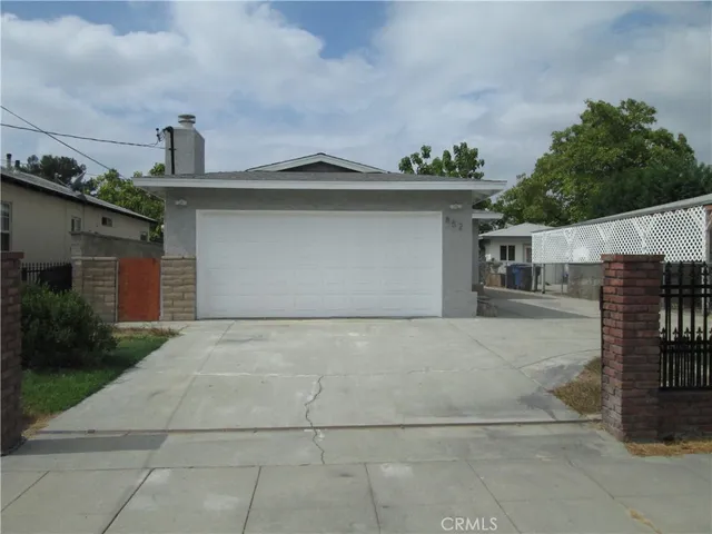 a front view of a house with yard