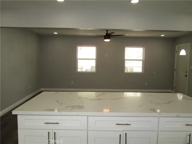 a view of a sink a window and an entryway