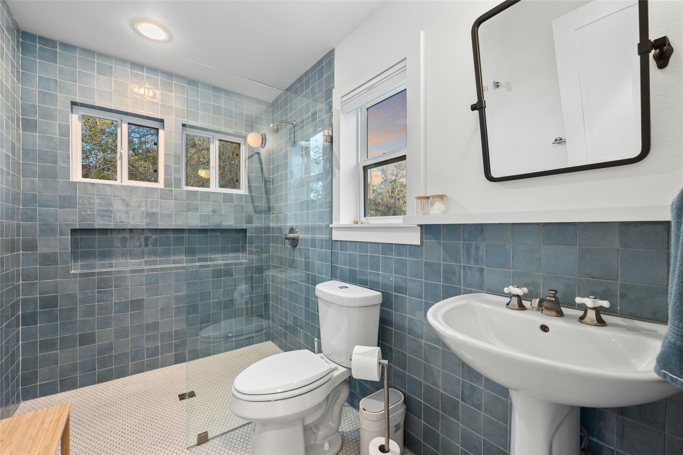 550 Cliffside Road Wimberley, TX 78676 - Photo 26 of 35 a bathroom with a sink a toilet and mirror