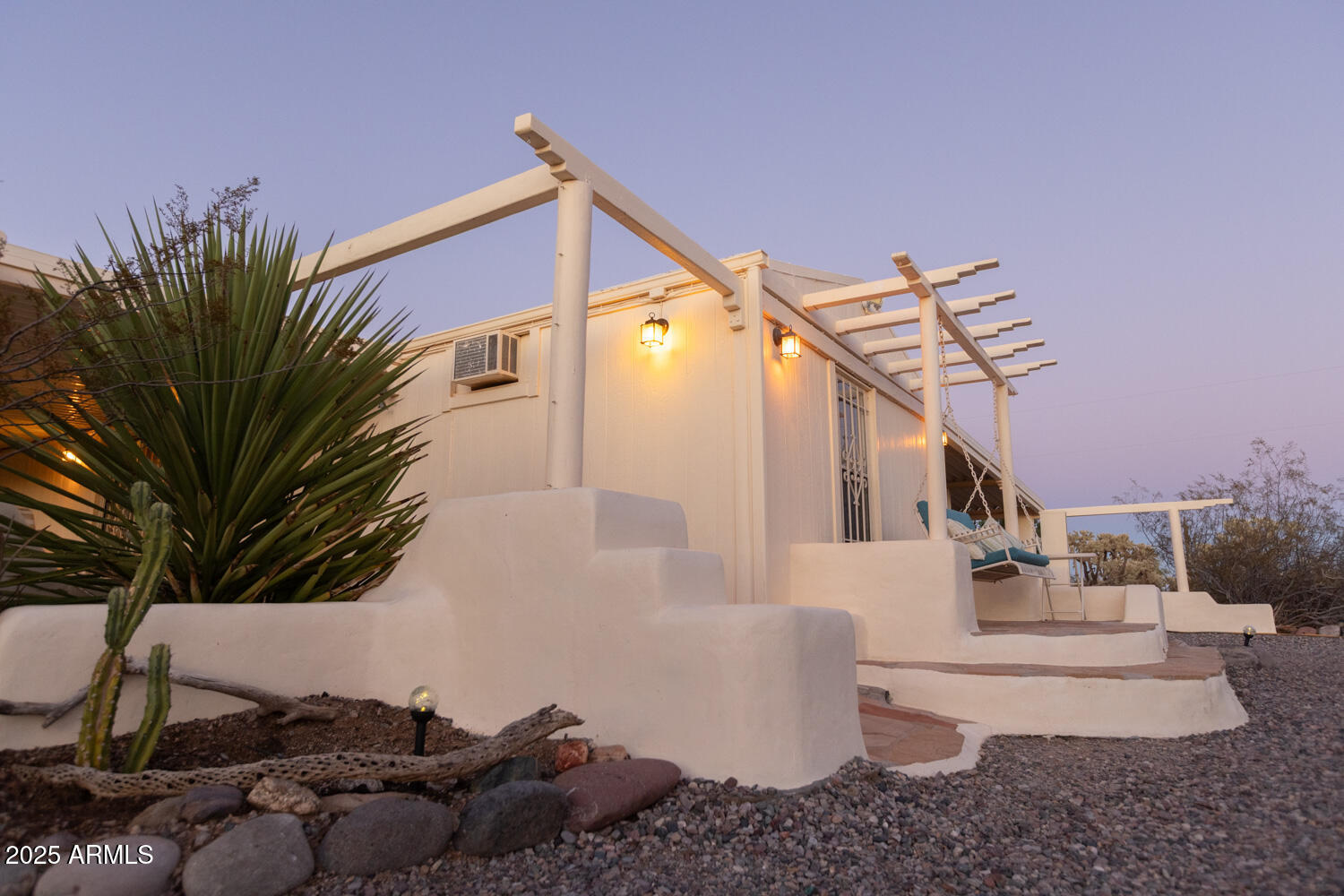 8362 North Dead Mans Gulch Road Florence, AZ 85132 - Photo 7 of 62 a view of a house with a couches and a fire pit