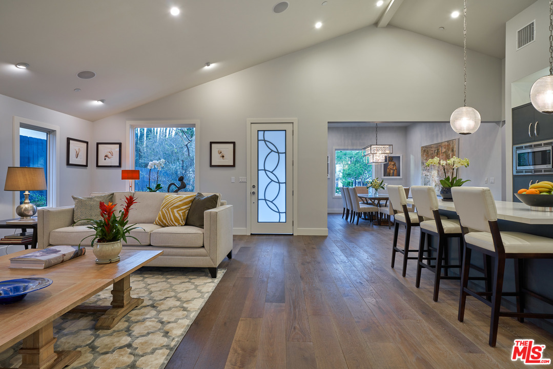 11622 Addison Street Valley Village, CA 91601 - Photo 11 of 39 a living room with furniture and wooden floor