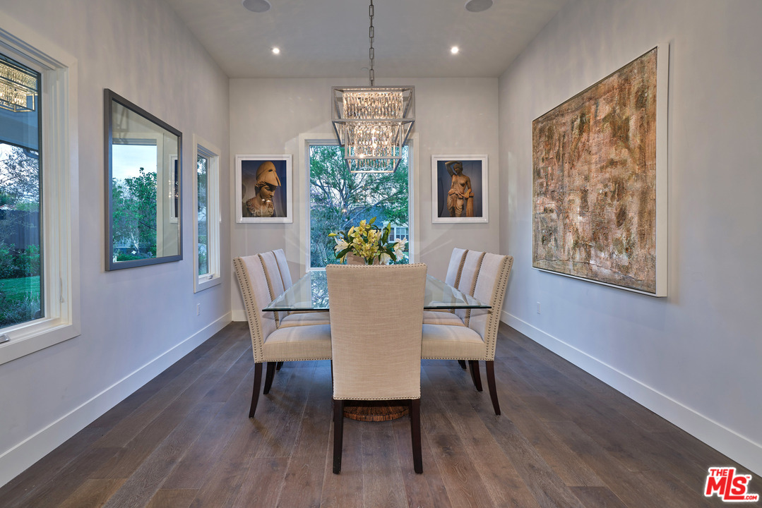 11622 Addison Street Valley Village, CA 91601 - Photo 15 of 39 a dining room with furniture a window and wooden floor