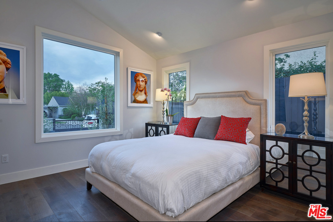 11622 Addison Street Valley Village, CA 91601 - Photo 20 of 39 a bedroom with a large bed and a window