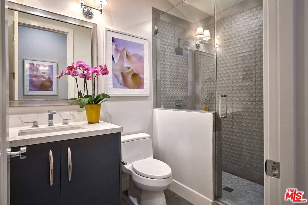 11622 Addison Street Valley Village, CA 91601 - Photo 21 of 39 a bathroom with a sink toilet and shower