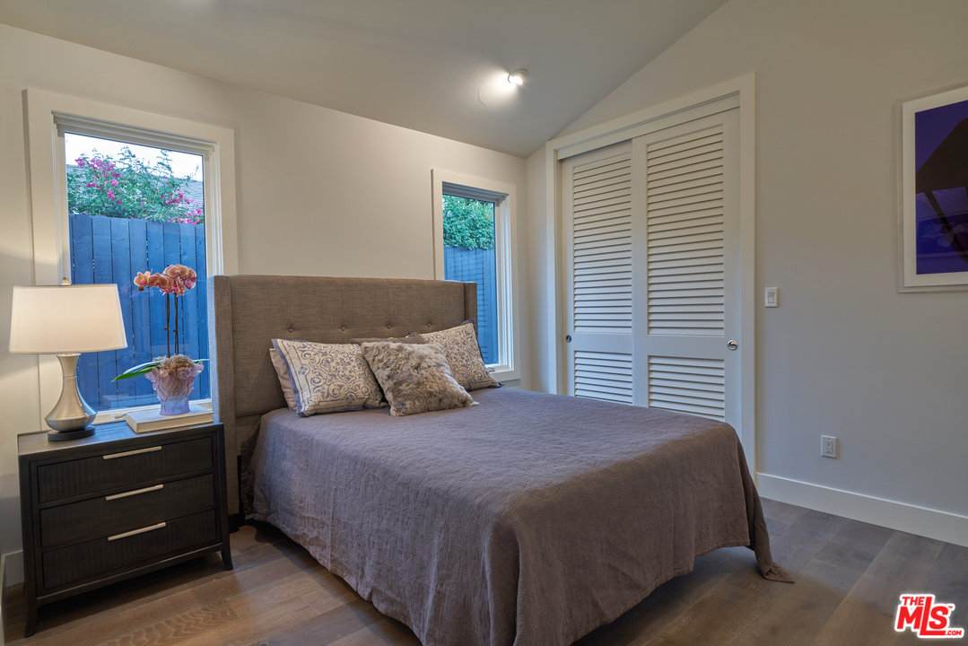 11622 Addison Street Valley Village, CA 91601 - Photo 22 of 39 a bedroom with a bed and a window
