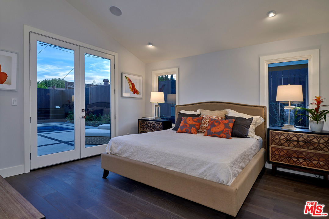 11622 Addison Street Valley Village, CA 91601 - Photo 34 of 39 a bedroom with a large bed and a window