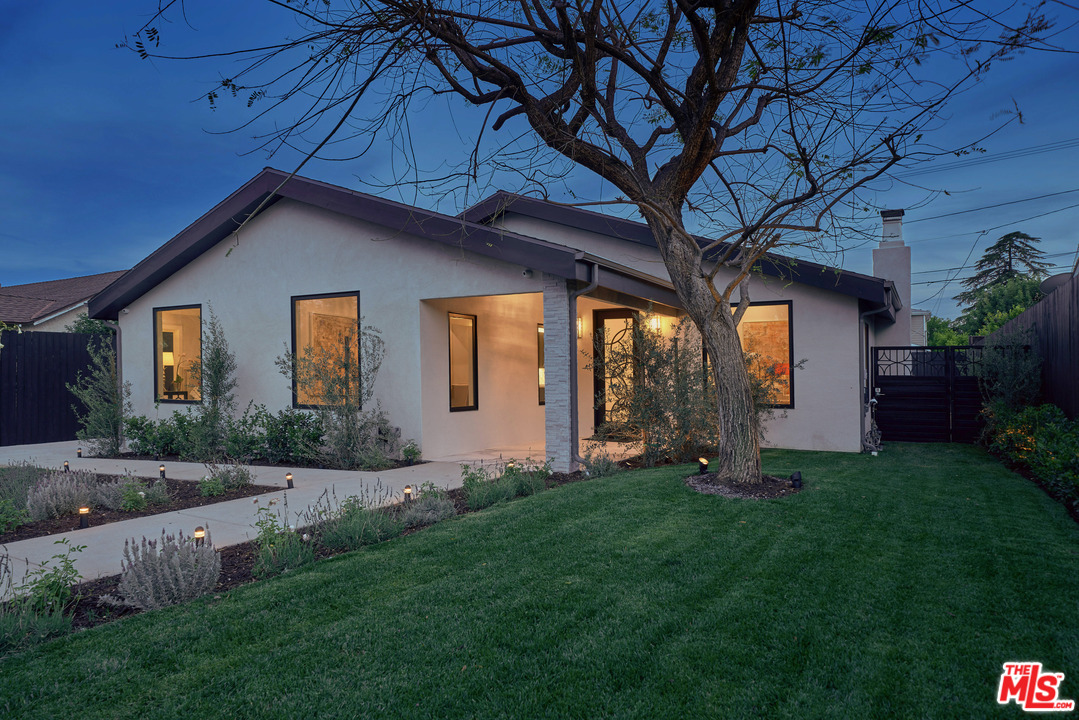 11622 Addison Street Valley Village, CA 91601 - Photo 5 of 39 a front view of a house with a yard and garage
