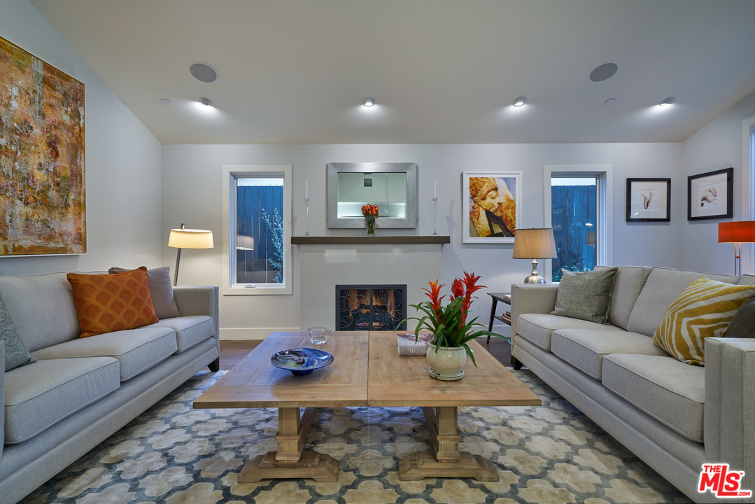 11622 Addison Street Valley Village, CA 91601 - Photo 10 of 39 a living room with furniture and a fireplace