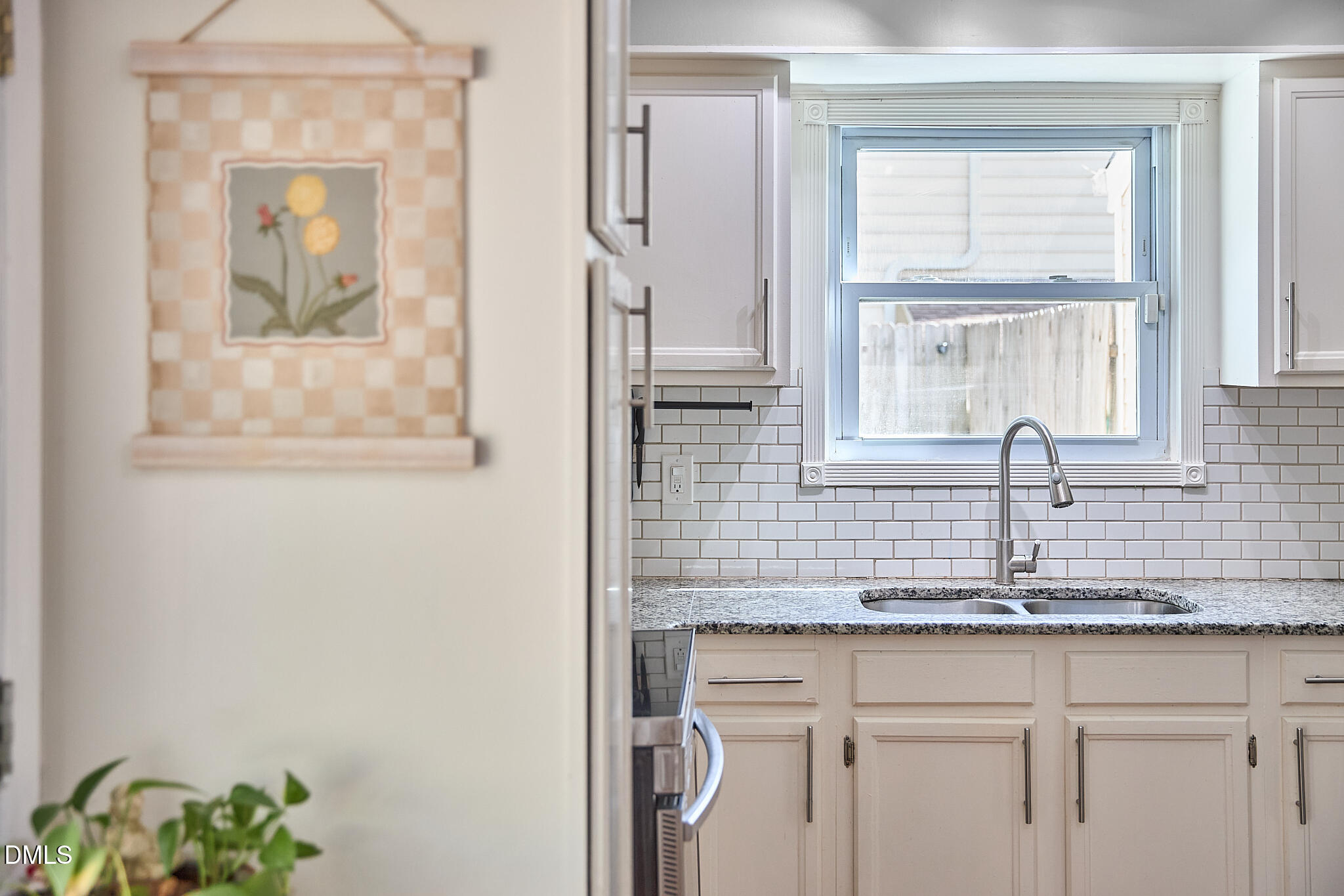 2102 Strebor Street Durham, NC 27705 - Photo 18 of 33 a bathroom with a sink a mirror and a window