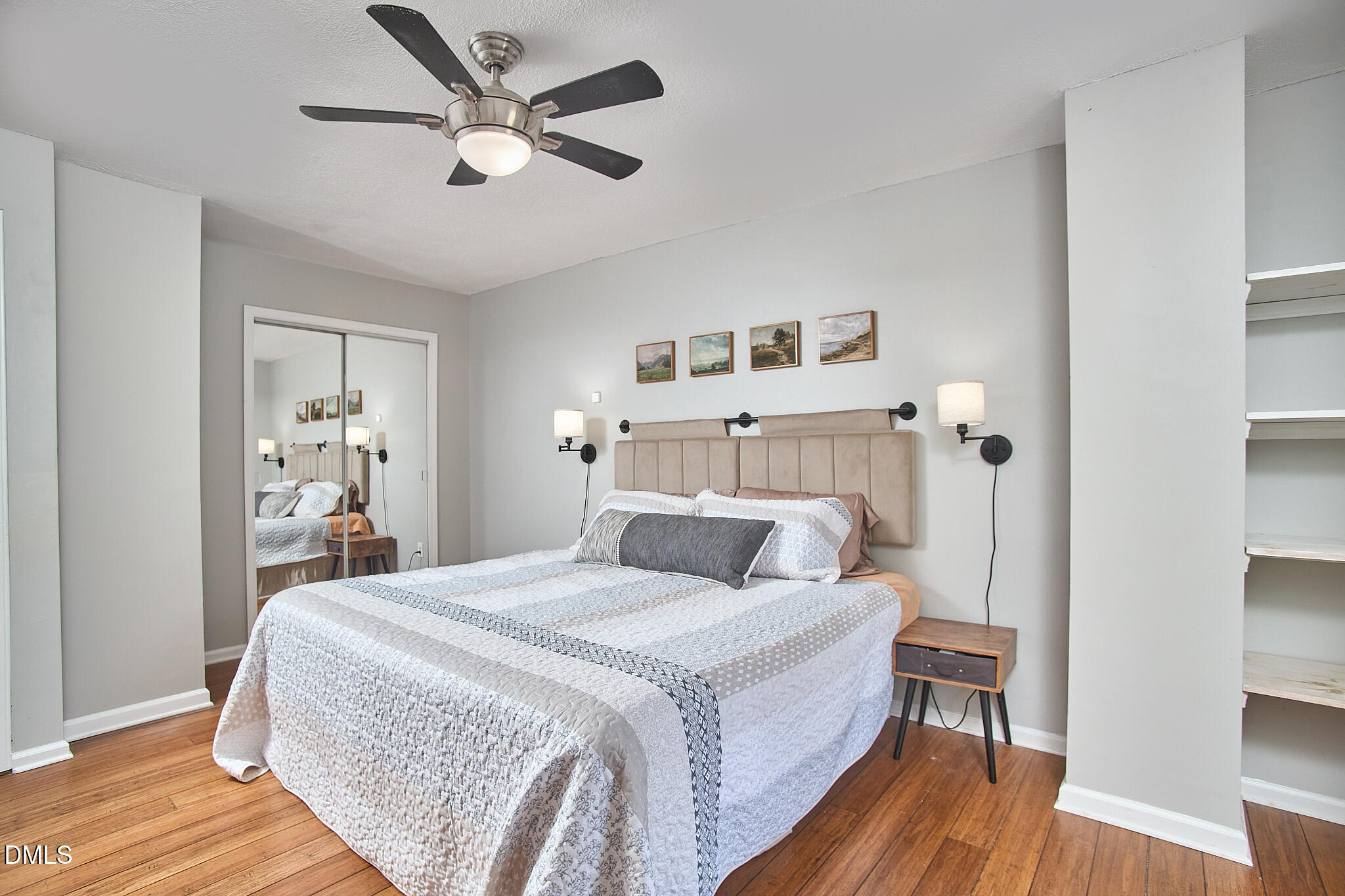 2102 Strebor Street Durham, NC 27705 - Photo 25 of 33 a bedroom with a large bed and a chandelier