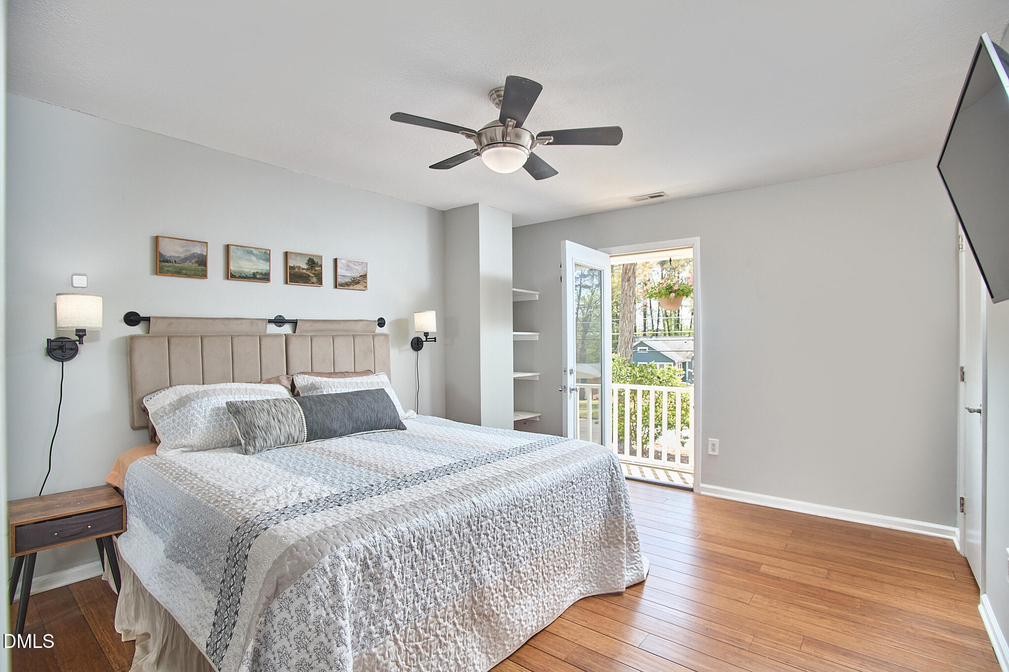 2102 Strebor Street Durham, NC 27705 - Photo 26 of 33 a bedroom with a large bed and a chandelier