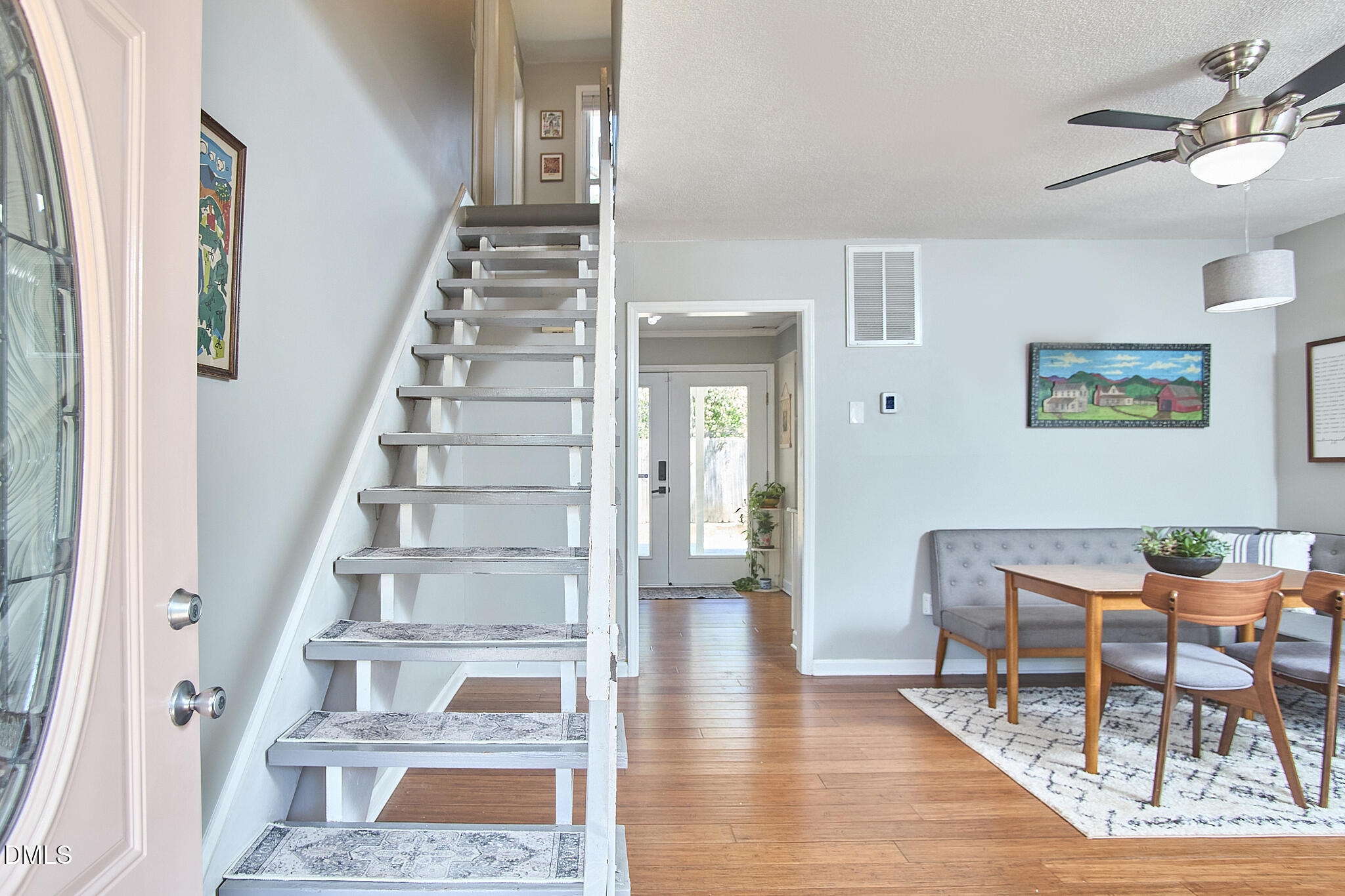 2102 Strebor Street Durham, NC 27705 - Photo 8 of 33 a view of an entryway with wooden floor and a rug