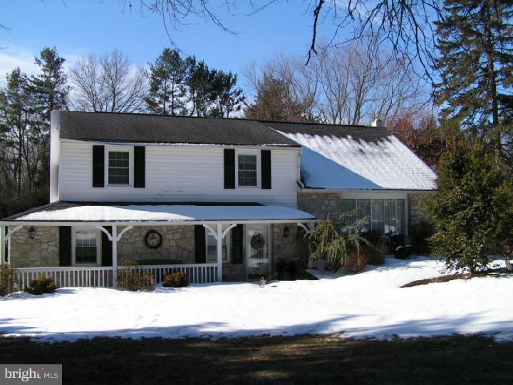 62 Brookline Road Warminster, PA 18974 - Photo 1 of 15 a front view of a house with a yard covered with snow