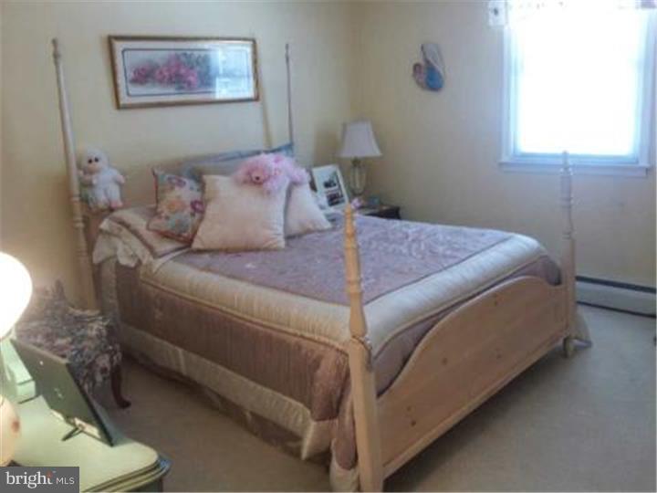 62 Brookline Road Warminster, PA 18974 - Photo 12 of 15 a bedroom with a bed and a painting on the wall