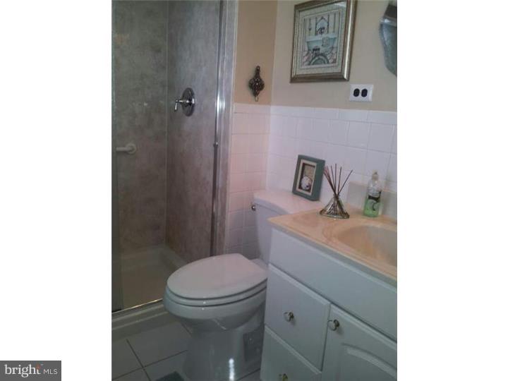 62 Brookline Road Warminster, PA 18974 - Photo 13 of 15 a bathroom with a toilet a sink and mirror