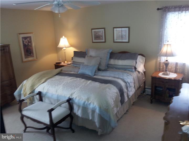 62 Brookline Road Warminster, PA 18974 - Photo 14 of 15 a bedroom with bed and a lamp