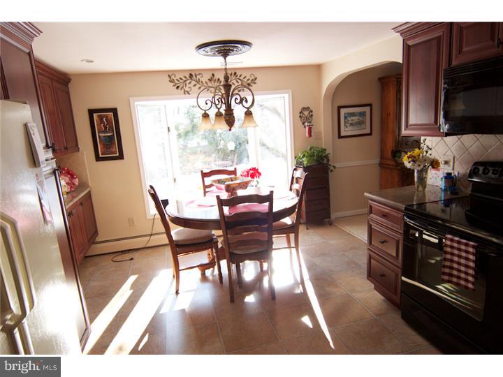 62 Brookline Road Warminster, PA 18974 - Photo 6 of 15 a view of a dining room with furniture a chandelier and wooden floor