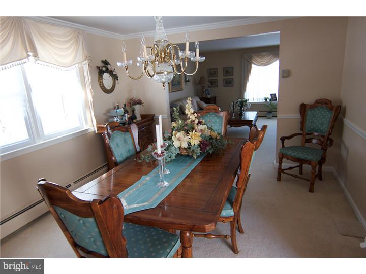 62 Brookline Road Warminster, PA 18974 - Photo 7 of 15 a view of a dining room with furniture and chandelier