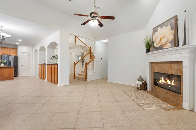 a view of an empty room with a fireplace