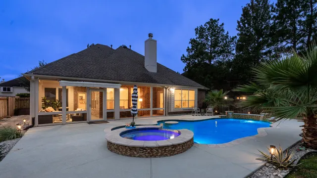 a swimming pool with outdoor seating