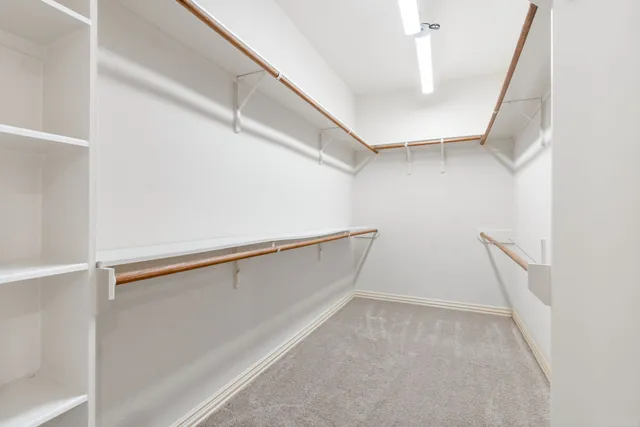 a view of an empty walk in closet