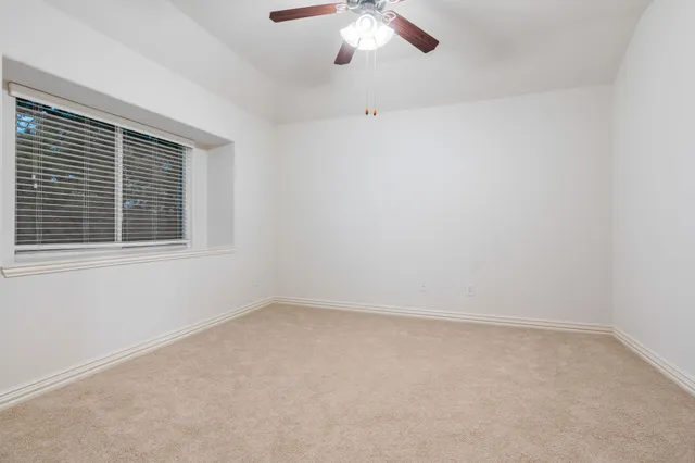 a bathroom with a sink a toilet and shower curtain