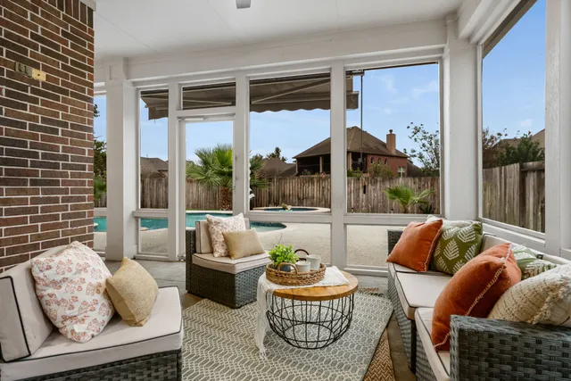 a view of a room that has a bed and a chair