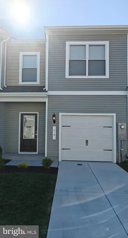 a view of house with backyard