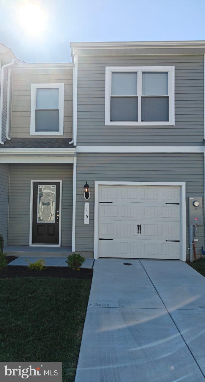 a view of house with backyard