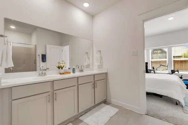 a white toilet sitting next to a white sink