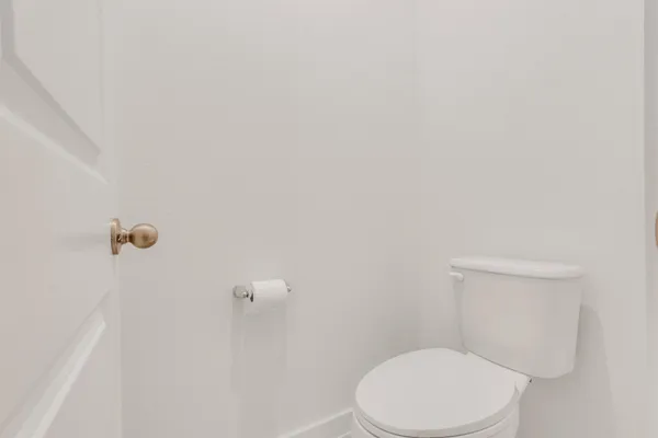 a living room with furniture a flat screen tv and a window