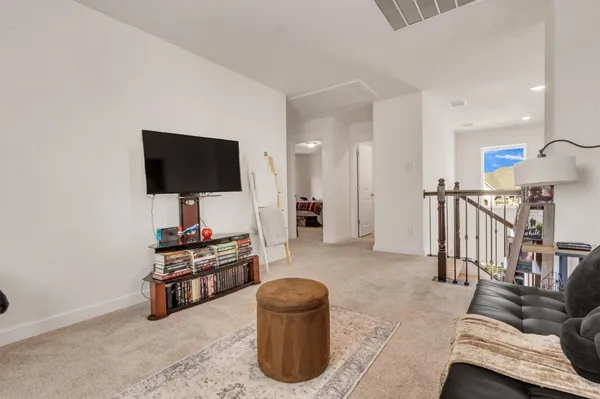 a bathroom with a sink a toilet a mirror and shower