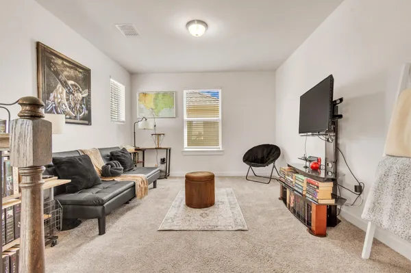 a bathroom with a sink mirror and toilet