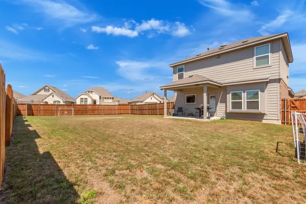 an aerial view of a residential apartment building with outdoor space
