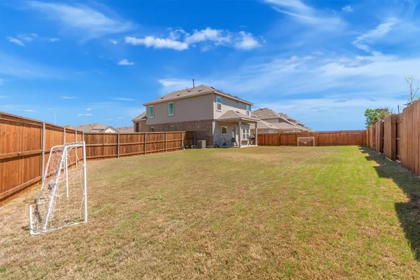 an aerial view of a residential apartment building with outdoor space