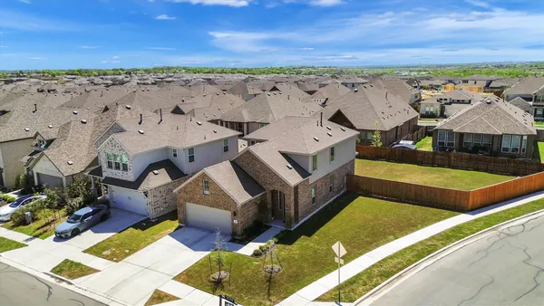 an aerial view of a building with outdoor space
