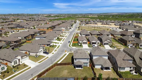 an aerial view of a house with a swimming pool