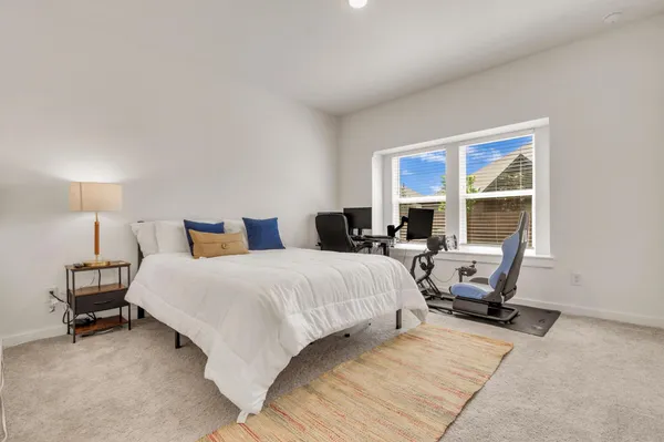 a en suite bathroom with double sink and a mirror