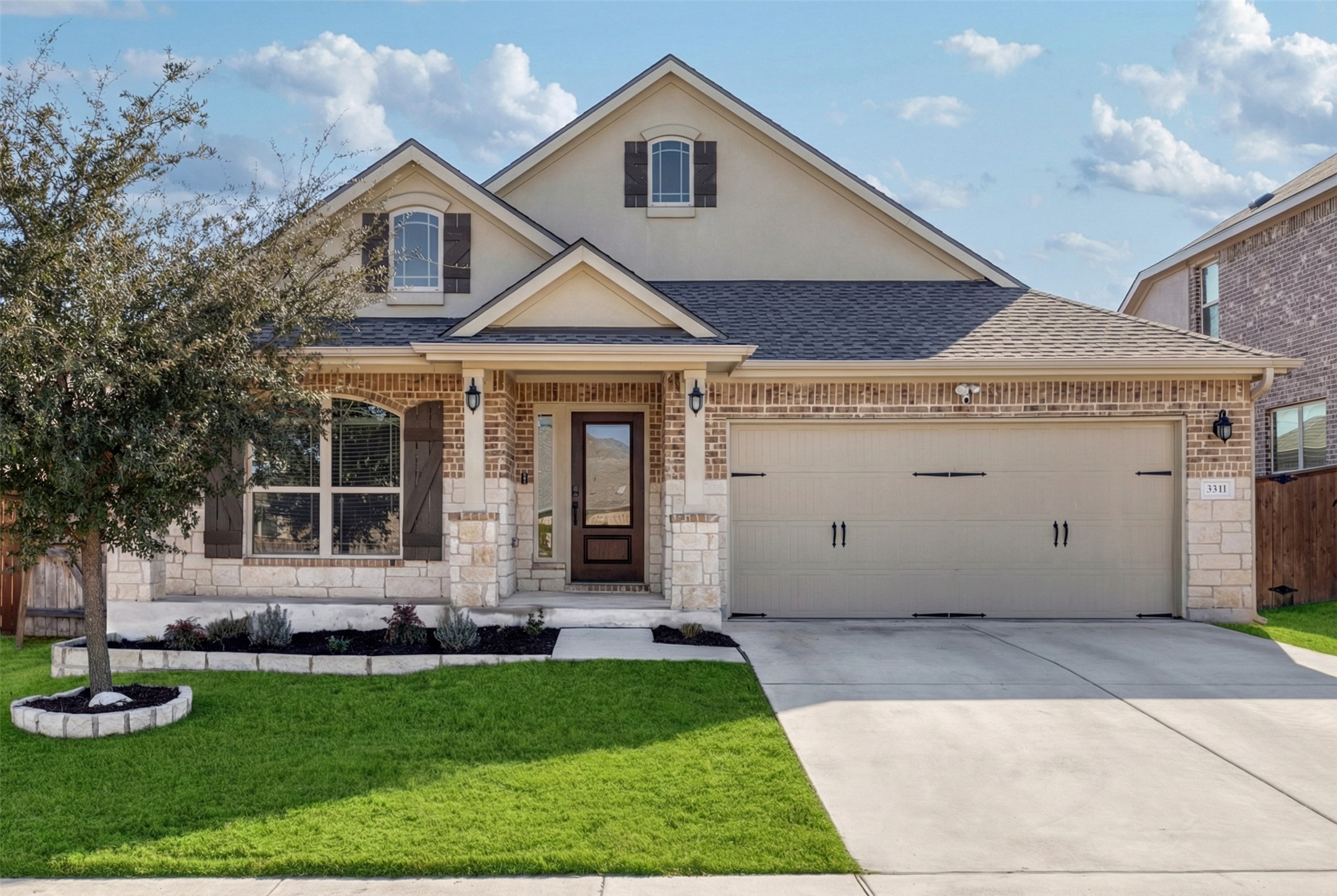 3341 Pauling Loop Round Rock, TX 78665 - Photo 1 of 40 View of front of property featuring brick siding, roof with shingles, covered porch, and driveway