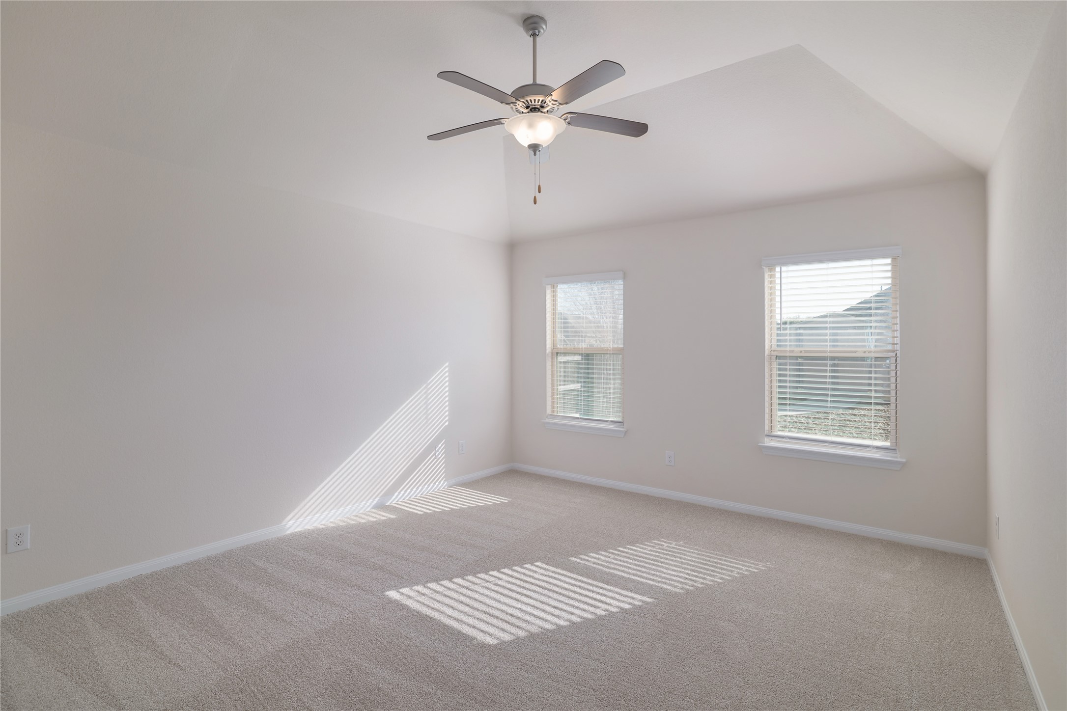 3341 Pauling Loop Round Rock, TX 78665 - Photo 16 of 40 Master bedroom with new carpet, ceiling fan and lofted ceiling