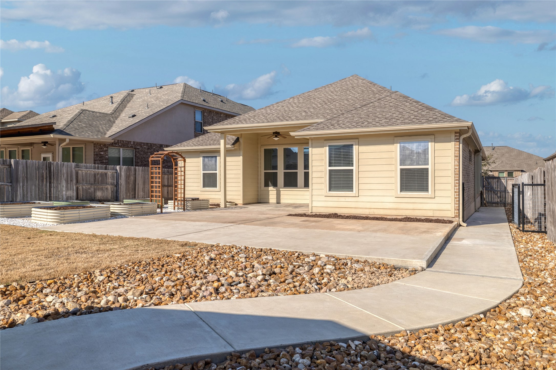 3341 Pauling Loop Round Rock, TX 78665 - Photo 29 of 40 Back of house featuring a ceiling fan, a patio, a gate, and a private fenced backyard
