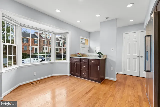 a room with a dresser and a window
