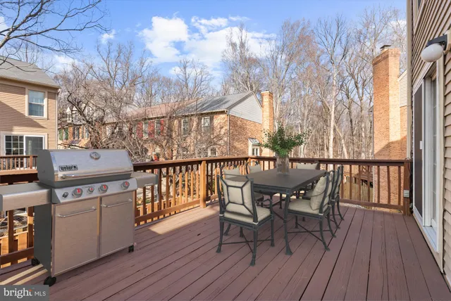 a view of a deck with table and chairs and wooden floor