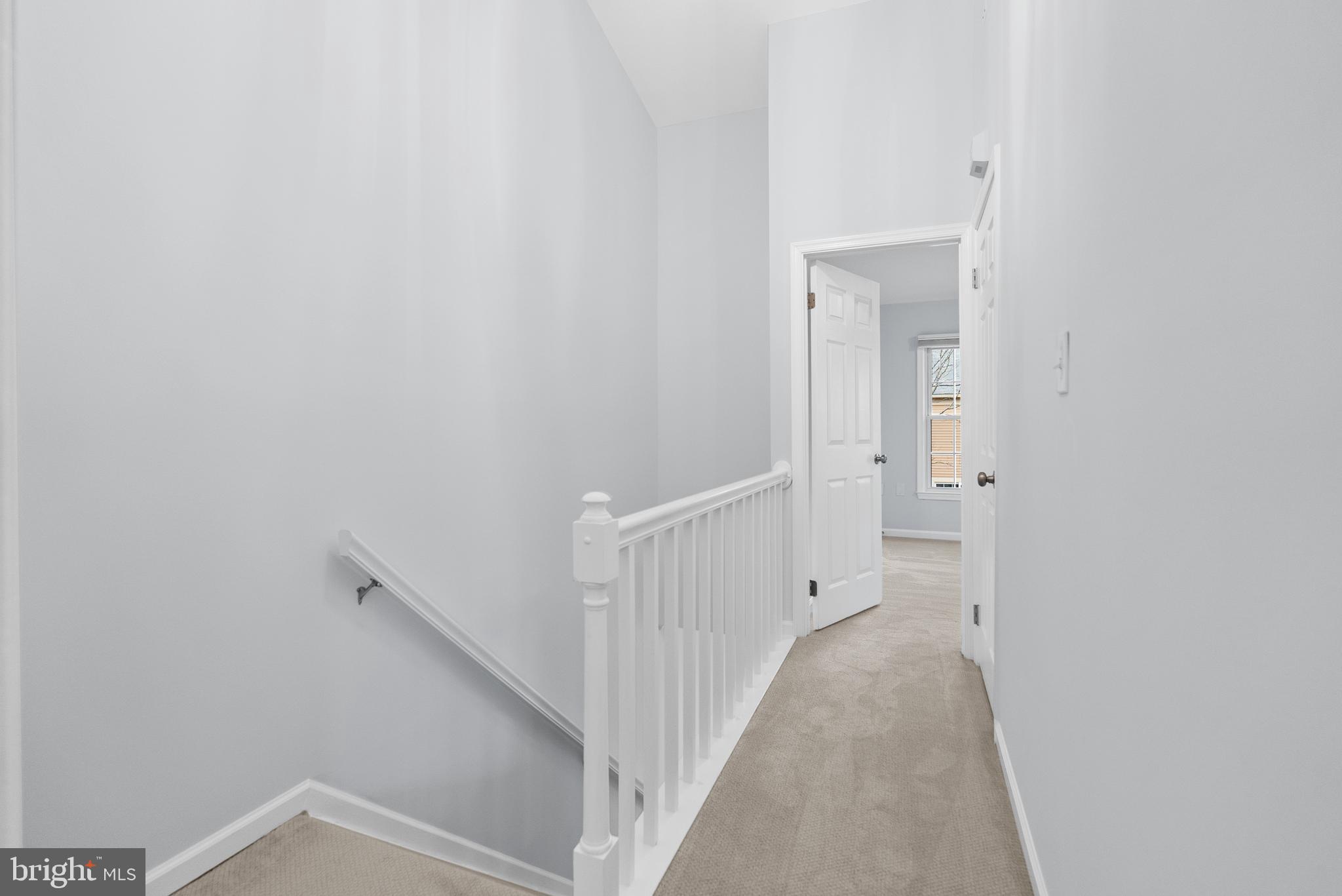 5465 Grove Ridge Way, Unit 123 Rockville, MD 20852 - Photo 17 of 39 a view of a hallway with staircase
