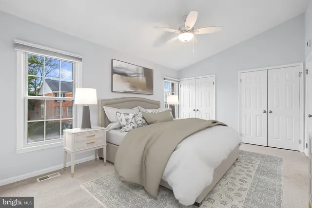 a spacious bedroom with a large bed and a window