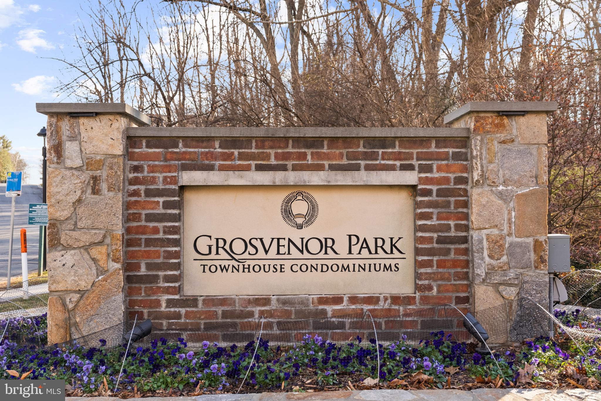 5465 Grove Ridge Way, Unit 123 Rockville, MD 20852 - Photo 2 of 39 a sign on the side of a building