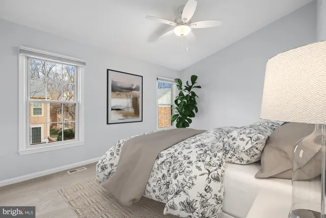 a bedroom with a large bed and a window