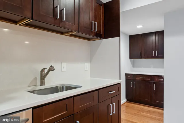 a kitchen with a sink and cabinets