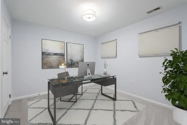 a view of a workspace with furniture