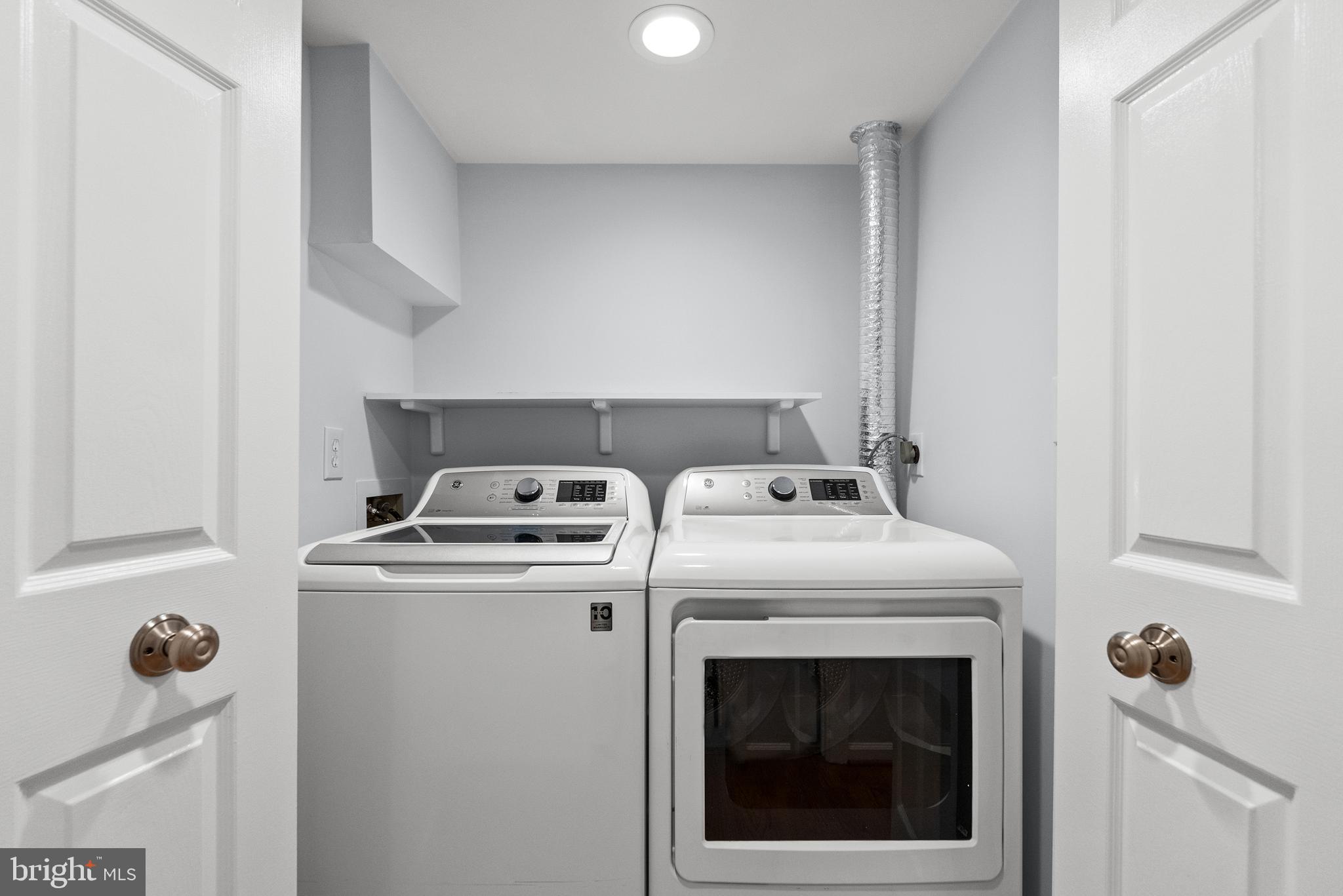 5465 Grove Ridge Way, Unit 123 Rockville, MD 20852 - Photo 29 of 39 a utility room with dryer and washer